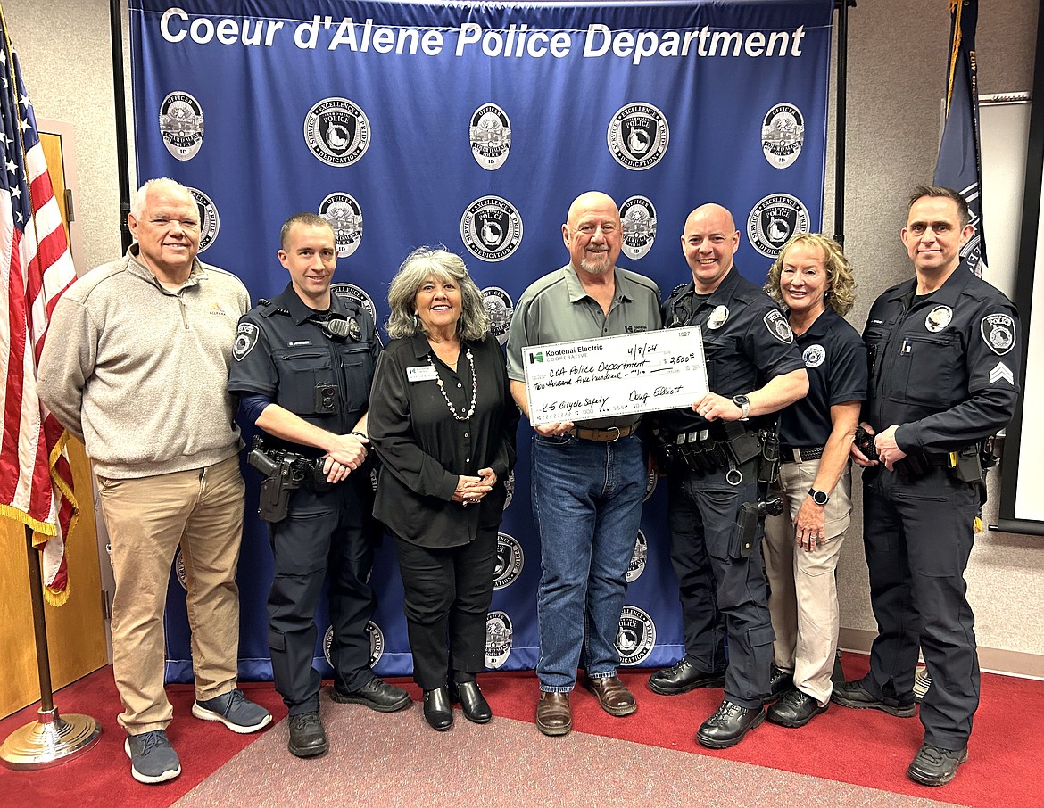 Kootenai Electric Cooperative donates $2,500 to the Coeur d'Alene Police Department for a bike safety program for kids. From left are Roger Stewart, owner of Allegra; Officer Matt Lovingier; Kerri Thoreson, KEC trust board; Jay Baker, KEC board chair; Officer Alan Gilbert; Teri Heinrich, crime prevention specialist; and Sgt. Jared Reneau.