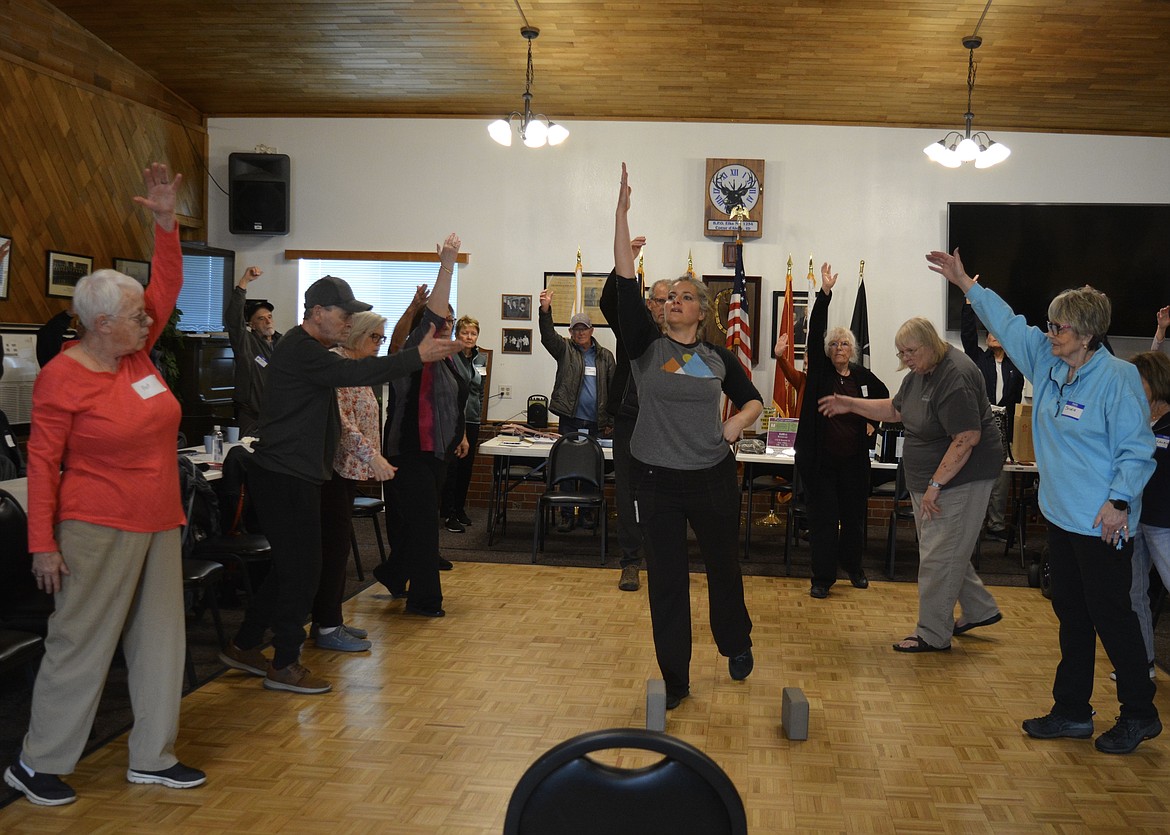 Jill Ciccarello, CEO and Research Program Director of Inland Northwest Research leads yoga during a Parkinson'S Support Group at the Coeur d'Alene Elks Lodge. She has a background in neurological research, including Parkinson’s, TBI, PTSD and Alzheimer’s.