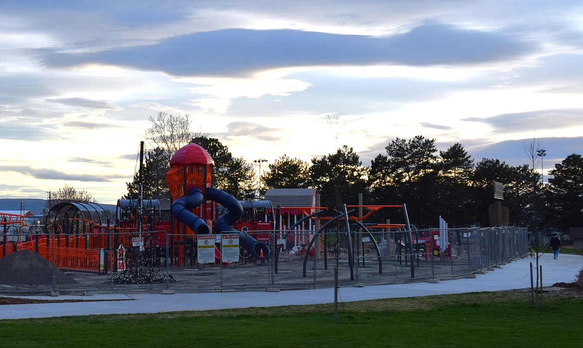 The north side of the Iron Horse Playground is surrounded by a walking path in the middle of Othello’s Lions Park. Othello Public Works Director Curt Carpenter said the city is shooting for a May unveiling of the new playground and basketball courts.