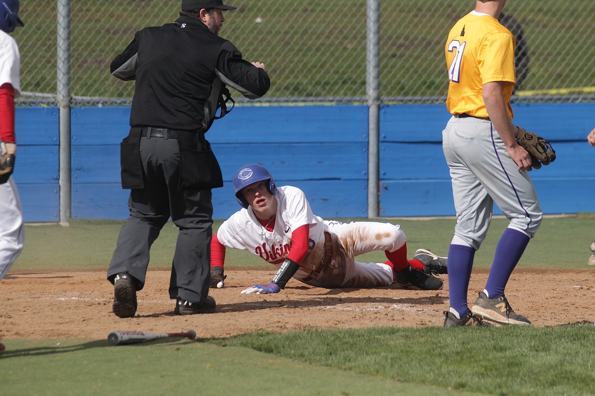 MARK NELKE/Press
Tyler Voorhees of Coeur d'Alene looks up after scoring in the first game against Lewiston on Tuesday at Ted Page Field.