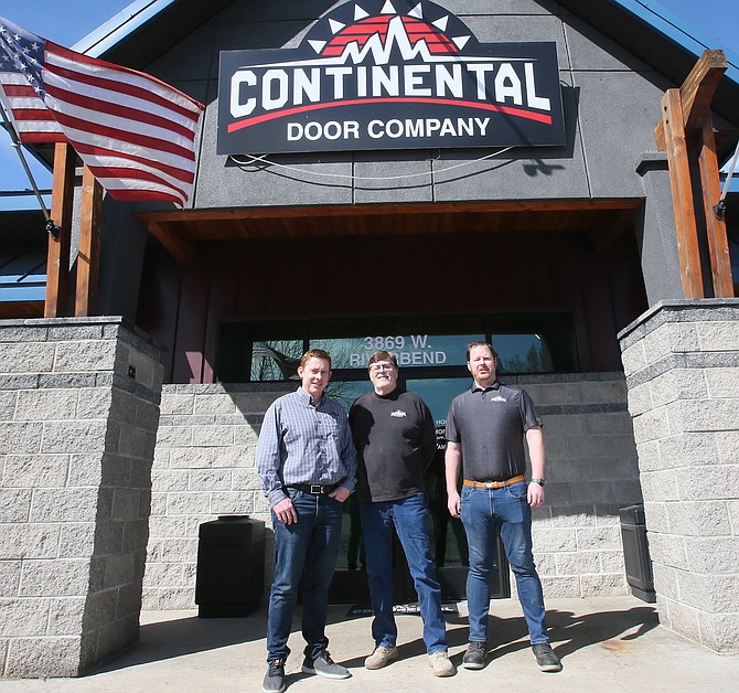 From left, son Marc Morse, father Norm Morse and son Derik Morse are seen outside their Post Falls Continental Door Company location.