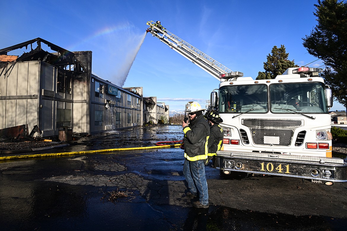West Valley Fire & Rescue firefighters work at the scene of a fire at the Quality Inn on U.S. Highway 2 West in Kalispell on Wednesday evening, April 10. (Casey Kreider/Daily Inter Lake)