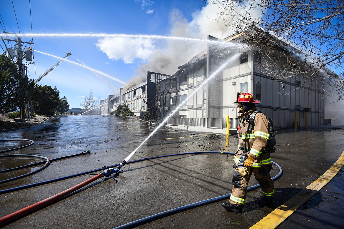 Kalispell Fire Department firefighters battle a fire at the Quality Inn on U.S. Highway 2 West in Kalispell on Wednesday, April 10. (Casey Kreider/Daily Inter Lake)