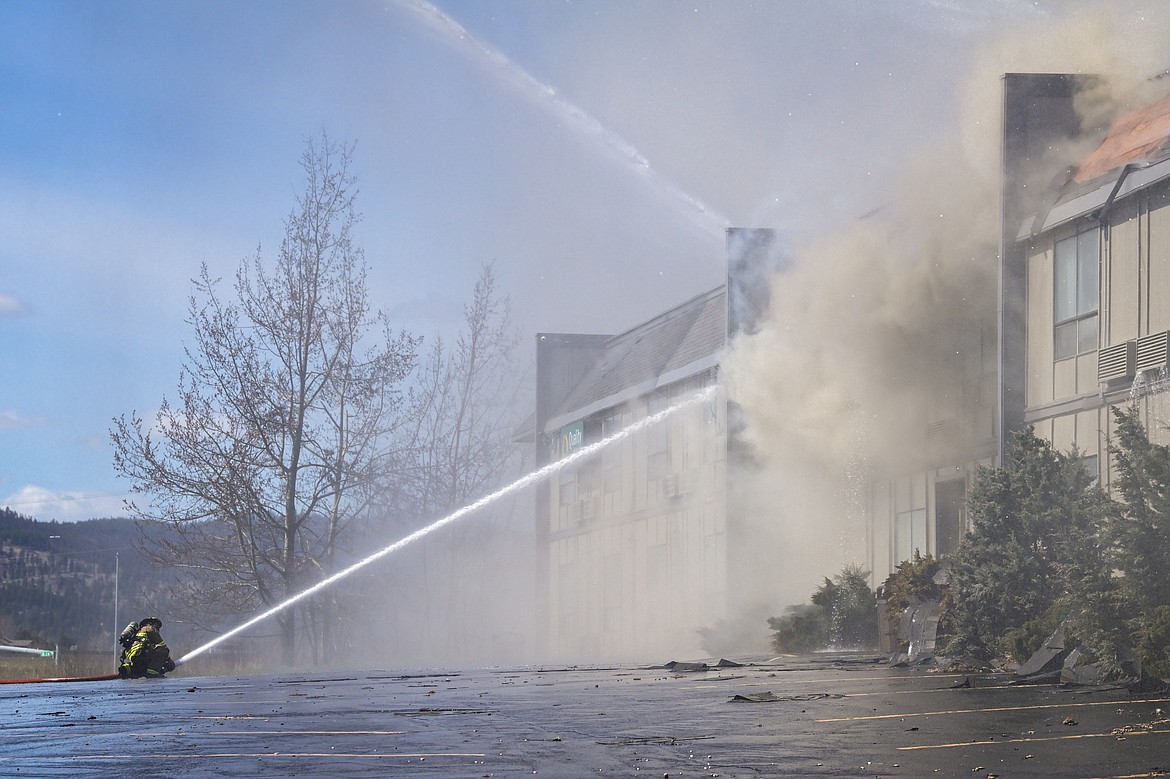 Firefighters battle a blaze at the Quality Inn on U.S. Highway 2 West in Kalispell on Wednesday, April 10. (Casey Kreider/Daily Inter Lake)