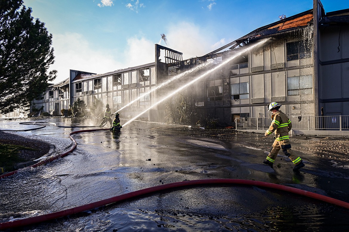Firefighters work at the scene of a fire at the Quality Inn on U.S. Highway 2 West in Kalispell on Wednesday evening, April 10. (Casey Kreider/Daily Inter Lake)