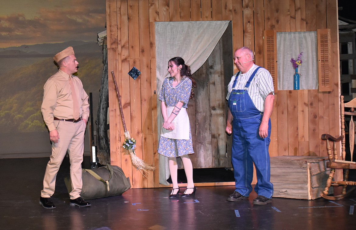 Billy (David Andersen, left) learns from his childhood friend Margo (Isabel Sica) and his father Daddy Cane (Ted Mack) that his mother passed away while he was off fighting World War II in Basin Community Theatre’s production of “Bright Star,” which opened Thursday.