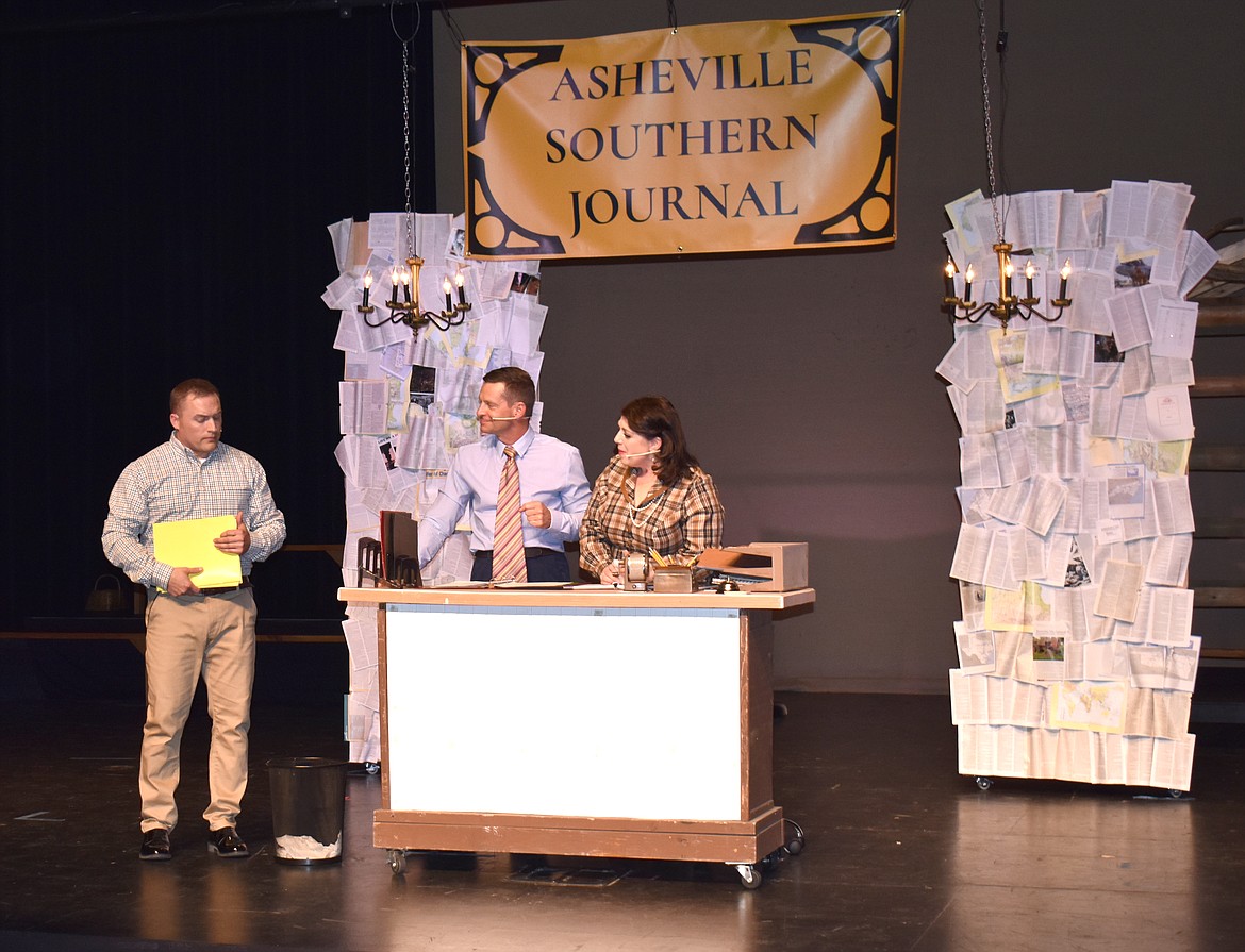 Billy (David Andersen, left) tries to submit some stories he’s written to Darryl Ames (Toby Black) and Lucy Grant (Shanna Stakkeland), the cynical staff at the Asheville Southern Journal.