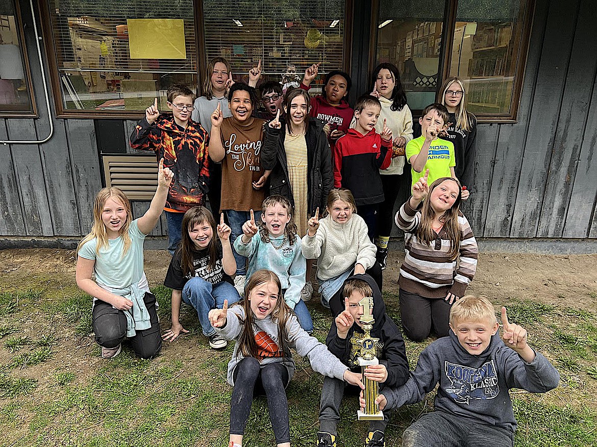 Each semester in Physical Education at Libby Elementary School, a fun run/fitness check (pre-test for their mile run) happens for students. The class with the highest average number of laps during a set time wins. First place went to Mrs. Thoeny's fifth grade class where each student averaged 20 laps = 0.93 mile to edge out Ms. Berry's fifth grade 5 class who came in second and Mrs. Sherbo's fourth grade class won third.
When the kids were presented with the trophy, they jogged a couple of laps around the gym to the song, "We are the CHAMPIONS" and everyone got a chance to carry the trophy. (Photo courtesy Libby Elementary School)