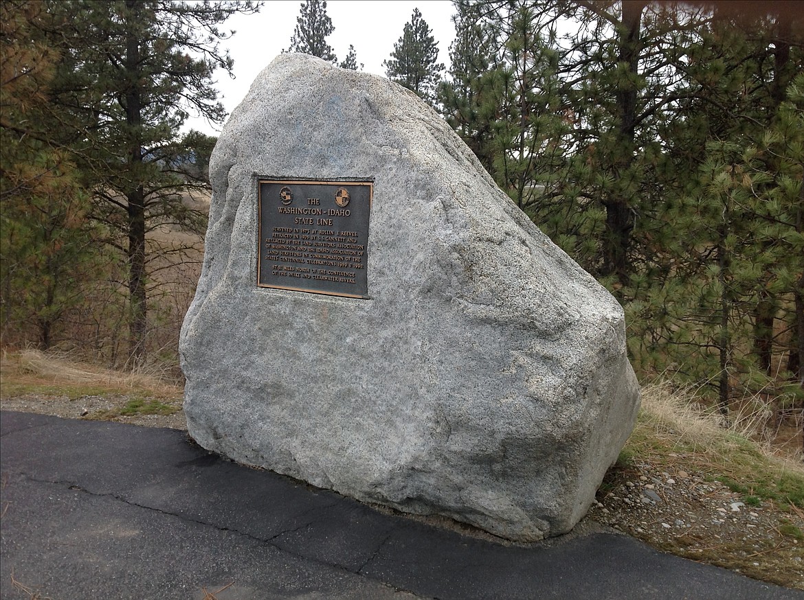Centennial Rock with a plaque honoring surveyor Rollie Reeves.