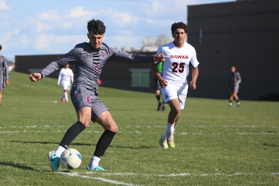 Wahluke junior Alex Acevedo (6) shoots the ball in front of the College Place net in the first half.