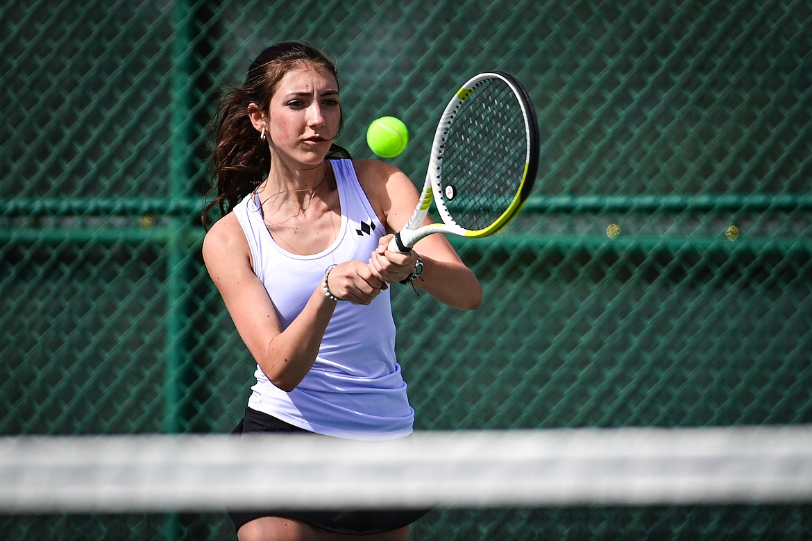 Glacier's Leilani Lennarz hits a backhand return against Flathead's Elle Westover in a girls singles match at Flathead Valley Community College on Thursday, April 11. (Casey Kreider/Daily Inter Lake)