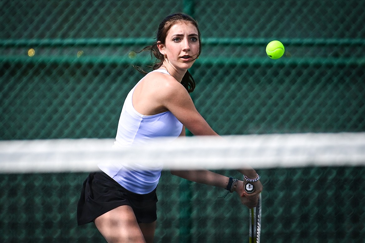 Glacier's Leilani Lennarz hits a backhand return against Flathead's Elle Westover in a girls singles match at Flathead Valley Community College on Thursday, April 11. (Casey Kreider/Daily Inter Lake)