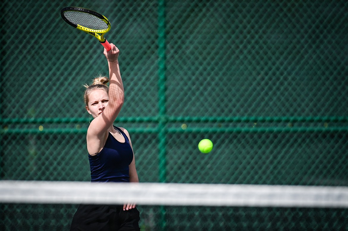 Glacier's Miley Fritz hits a return in a girls singles match against Flathead's Sarah Loran at Flathead Valley Community College on Thursday, April 11. (Casey Kreider/Daily Inter Lake)