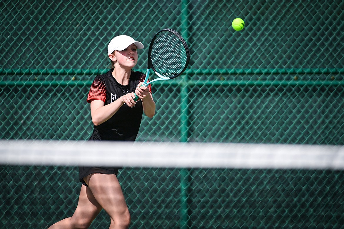 Flathead's Sarah Loran hits a backhand return in a girls singles match against Glacier's Miley Fritz at Flathead Valley Community College on Thursday, April 11. (Casey Kreider/Daily Inter Lake)