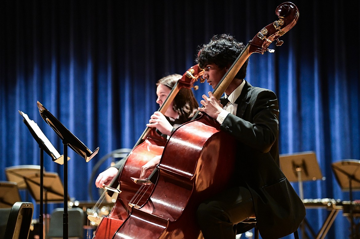 Members of the Flathead Symphonic Orchestra perform Renata Bratt's "Confluence" and Wolfgang Mozart and Thomas LaJoie's "Symphony No. 25, Movement 1" at the District Music Festival at Glacier High School on Thursday, April 11. (Casey Kreider/Daily Inter Lake)