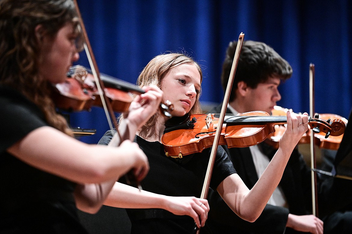 Members of the Flathead Symphonic Orchestra perform Renata Bratt's "Confluence" and Wolfgang Mozart and Thomas LaJoie's "Symphony No. 25, Movement 1" at the District Music Festival at Glacier High School on Thursday, April 11. (Casey Kreider/Daily Inter Lake)