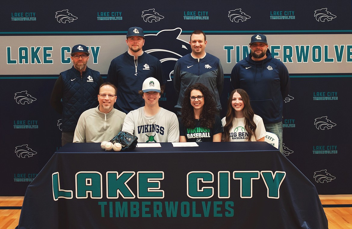 Courtesy photo
Lake City High senior AJ Currie recently signed a letter of intent to play baseball at Big Bend Community College in Moses Lake, Wash. Seated from left are Stephen Currie (father), AJ Currie, Pauline Currie (mother) and Brooklyn Currie (sister); and standing from left, Mike Criswell, Lake City High head baseball coach; Cody Garza, Lake City High assistant baseball coach; Troy Anderson, Lake City High athletic director; and Justin Garza, Lake City High assistant baseball coach.