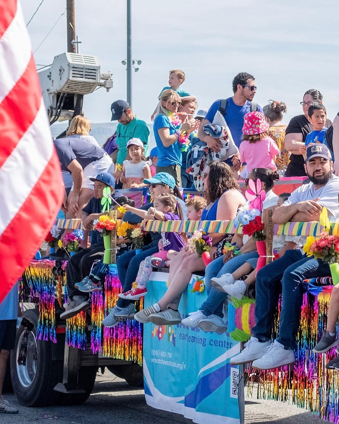 A packed float takes to the route during the 2023 Apple Blossom Festival youth parade.
