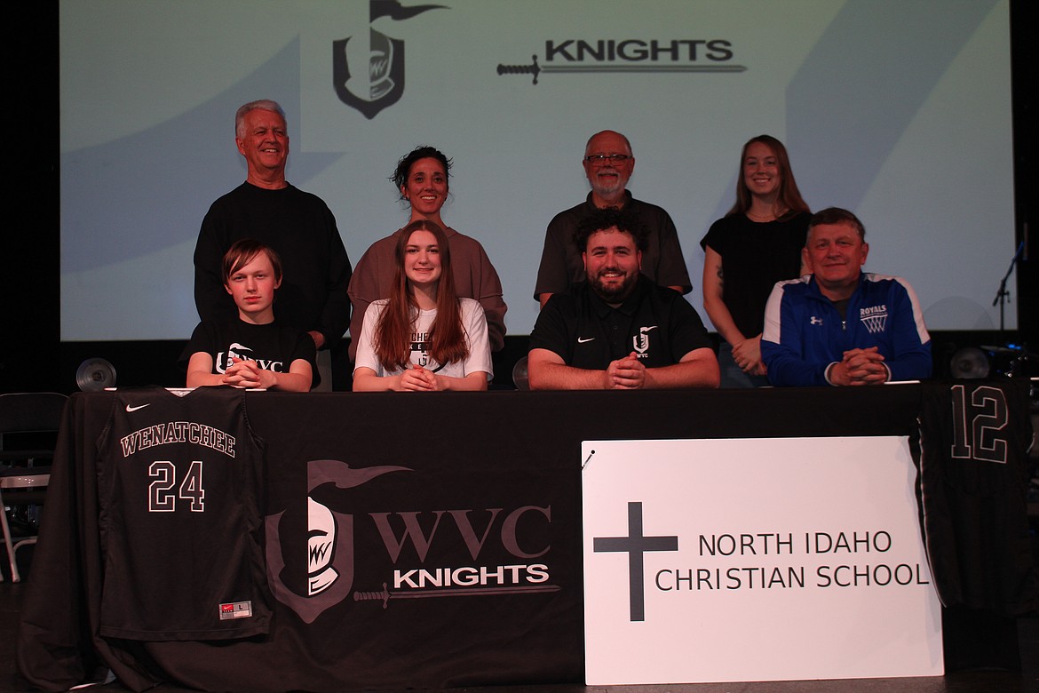 Courtesy photo
North Idaho Christian School senior Danica Kelly recently signed a letter of intent to play basketball at Wenatchee Valley College. Seated from left are A.J. Kelly (brother), Danica Kelly, Adam Todd-Thomas (Wenatchee Valley College women's basketball coach) and Dave Kelly (father); and standing from left, Jerry Bittner, North Idaho Christian school head girls basketball coach; Jennifer Scott, North Idaho Christian School administration; Brad Alden, North Idaho Christian School athletic director; and Kylee Andrews, North Idaho Christian School assistant girls basketball coach.