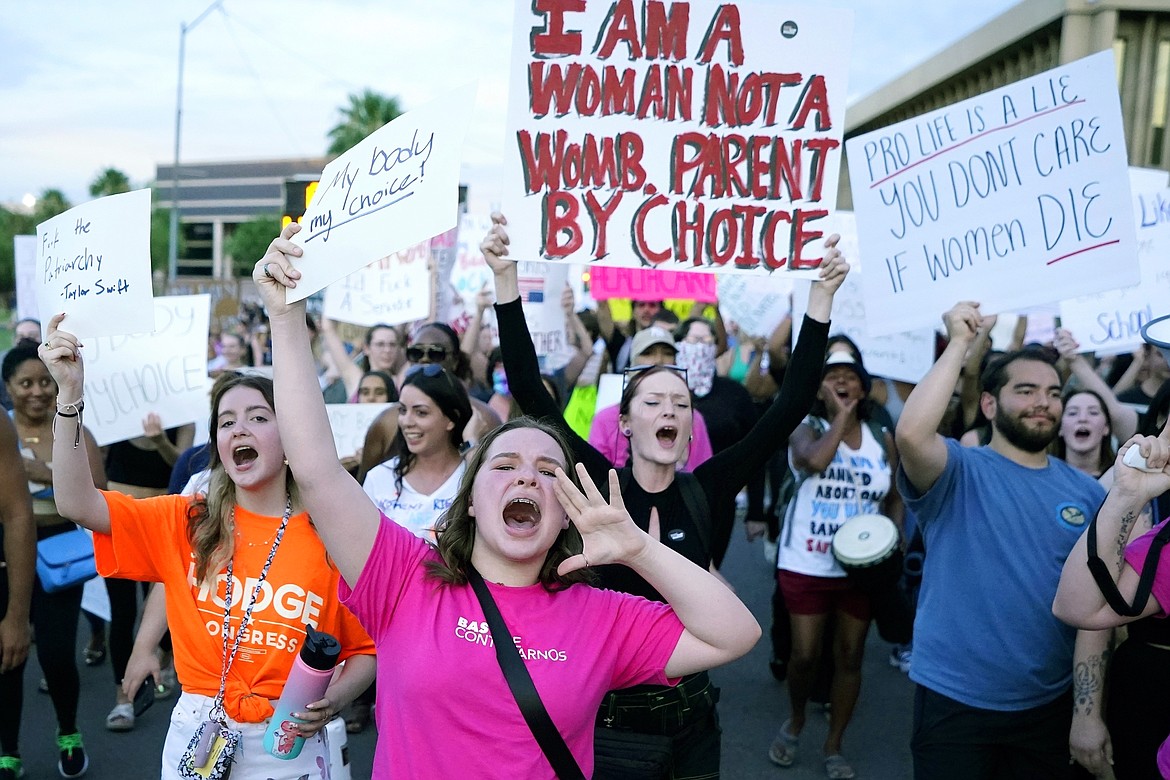 Protesters in Phoenix shout as they join thousands marching around the Arizona state Capitol after the U.S. Supreme Court decision to overturn the landmark Roe v. Wade abortion decision on June 24, 2022. A stunning abortion ruling this week in April 2024, has supercharged Arizona’s role in the looming fall election. (AP Photo/Ross D. Franklin, File)