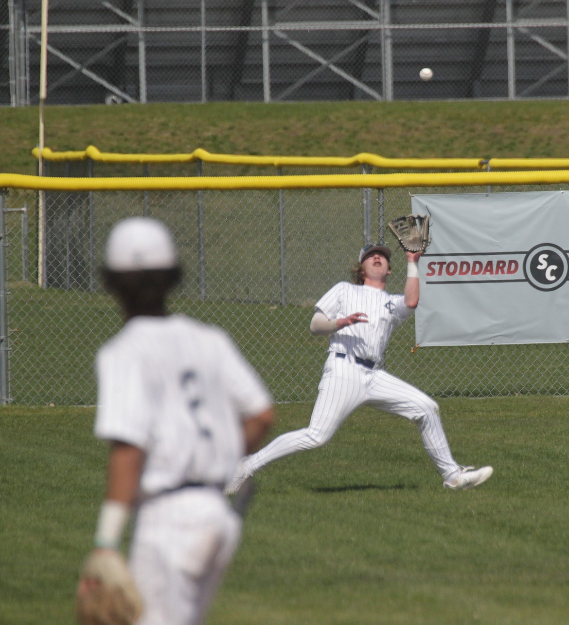 MARK NELKE/Press
Lake City left fielder Nate Weatherhead camps under a fly ball during the first game vs. Lewiston on Saturday at Lake City.