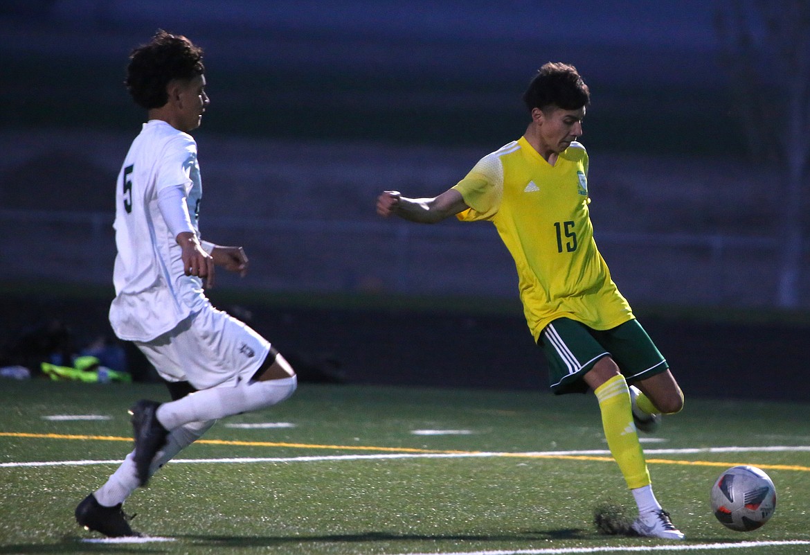 Quincy junior Danny Mendoza (15) sets up a shot in overtime against Chelan on Thursday. Mendoza scored the eventual game-winning goal against the Mountain Goats.