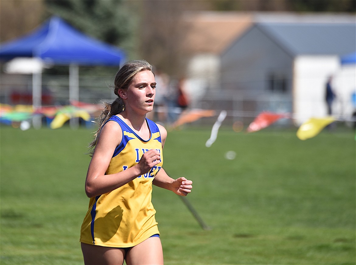 Libby's Capri Farmer runs in the 3,200-meter run on Saturday, April 13, 2024 at the Libby Track and Field Invitational. (Scott Shindledecker/The Western News)