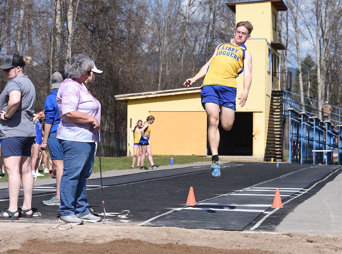 Libby's Greysen Thompson long jumps on Saturday, April 13, 2024 at the Libby Track and Field Invitational. (Scott Shindledecker/The Western News)
