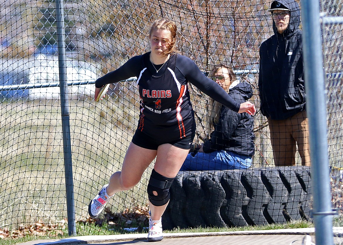 Plains junior Alexis Demming, the defending state B champion, winds and uncorks a first place throw at this past weekend's Dave Tripp Memorial Invitational track and field tournament in Polson. (Photo by Bob Gunderson)