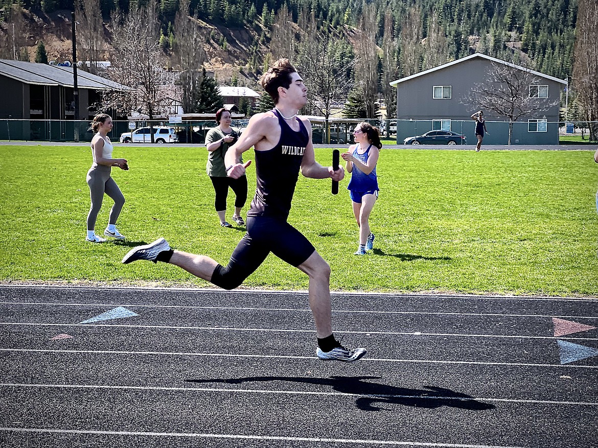 Kellogg sprinter Radley McDonald races across the finish line during the boys 4x200 meter race at the Kellogg Relays.