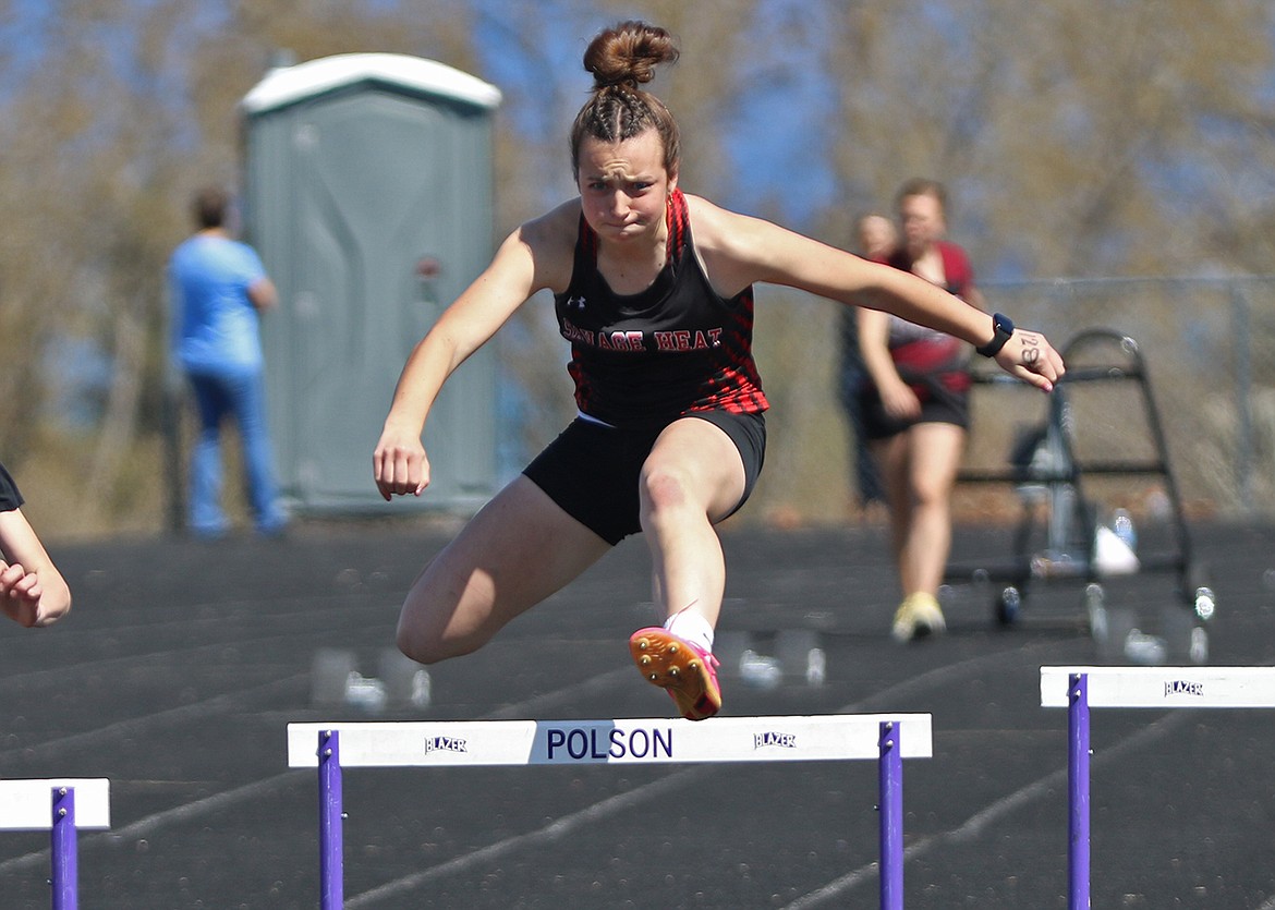 Hot Springs sophomore Kara Christensen clears the first hurdle in the women's 110 meter hurdles event at this past Saturday's Dave Tripp Invitational track meet in Polson. (Photo by Bob Gunderson)