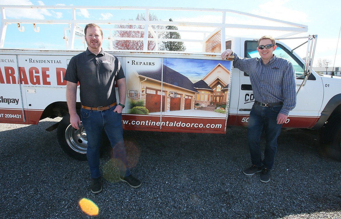 Residential business unit manager Derik Morse, left, and brother Marc Morse, commercial business unit manager, are seen with a Continental Door Company vehicle fondly called "The Pride of the Fleet." Continental Door has expanded into Post Falls with a brick-and-mortar showroom to strengthen customer relationships in North Idaho.