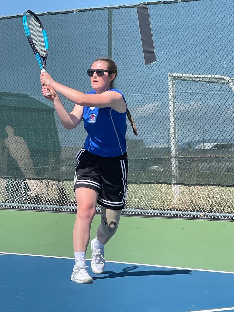 Superior senior Lanie Crabb returns a backhand shot in her home court return after a year out with a knee injury.  Crabb split a pair of number one singles in a multi-team match this past Saturday in Superior. (Photo by Micki Tourtelotte)