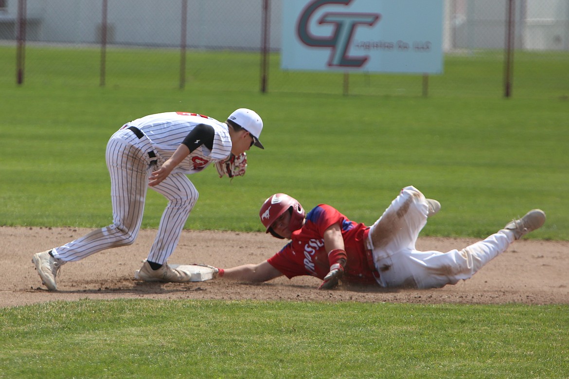 Othello junior Jordan Montemayor, left, tags out a Prosser base runner during the second game of Saturday’s doubleheader. Montemayor hit a three-run home run in the first game against Prosser on Saturday.