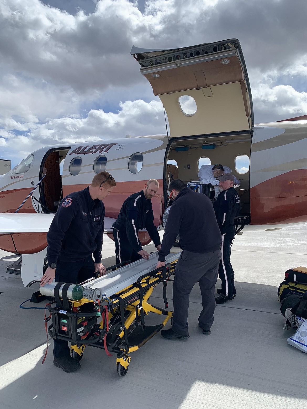 Montana Highway Patrol Trooper Lewis Johnson being loaded into the A.L.E.R.T. fixed wing airplane to be transported to  Craig Hospital in Denver, Colorado. (photo provided)