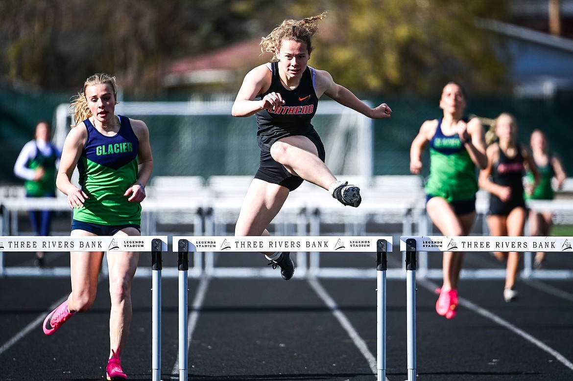 Flathead's Zoey Bortz clears a hurdle in the girls 300 meter hurdles at Legends Stadium on Tuesday, April 16. (Casey Kreider/Daily Inter Lake)