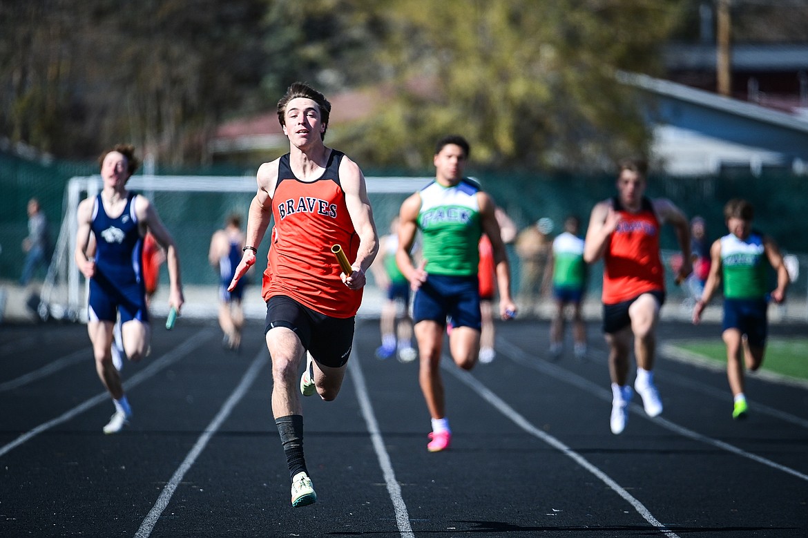 Flathead's Brody Thornsberry runs the anchor leg of the boys 4 x 100 meter relay at Legends Stadium on Tuesday, April 16. (Casey Kreider/Daily Inter Lake)