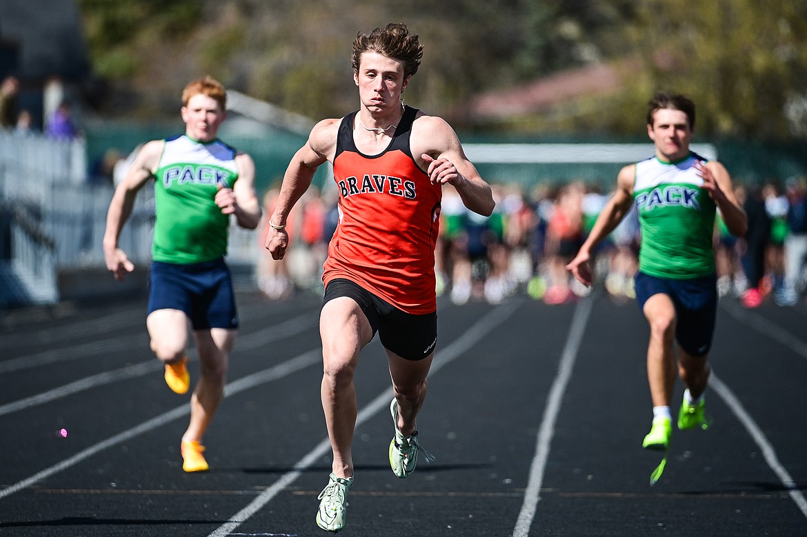 Flathead's Ben Bliven crosses the finish line in first in the boys 100 meter dash at Legends Stadium on Tuesday, April 16. (Casey Kreider/Daily Inter Lake)