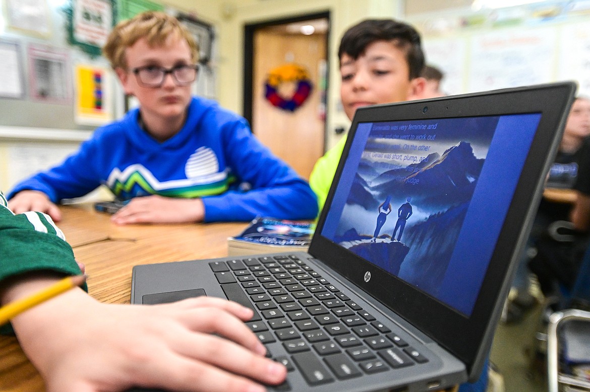 Students read over their stories and illustrations created using artificial intelligence software in seventh-grade teacher Kristi Sanders' class at Kalispell Middle School on Tuesday, April 16. (Casey Kreider/Daily Inter Lake)