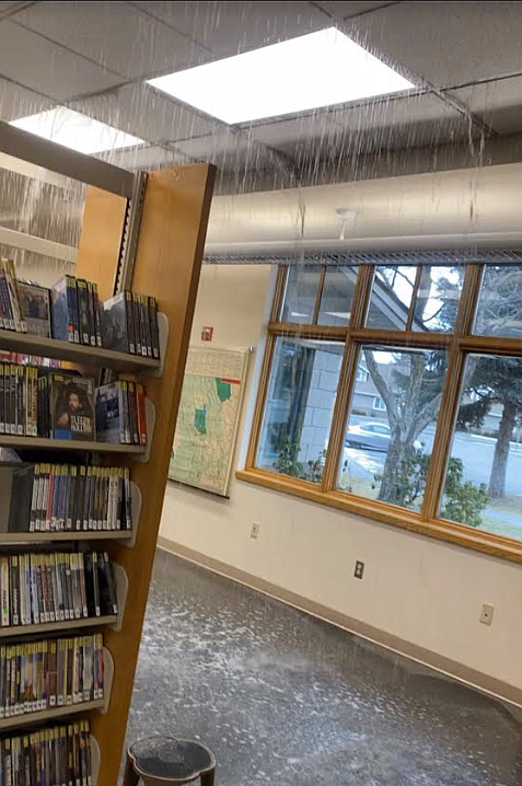 Water pours from the ceiling of the Post Falls Library in January after freezing weather ruptured the pipes and sprinkler system. Post Falls and Athol libraries, which have been closed for months due to weather damage, will resume limited services today. A facilities update is on the agenda for Thursday's meeting of the Community Library Network's board of trustees.