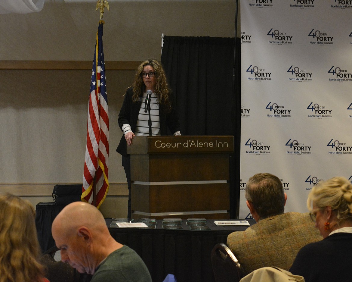 Kari Packer of Hagadone Media introduces Clint Schroeder during the North Idaho Business Journal’s 40 Under 40 awards.