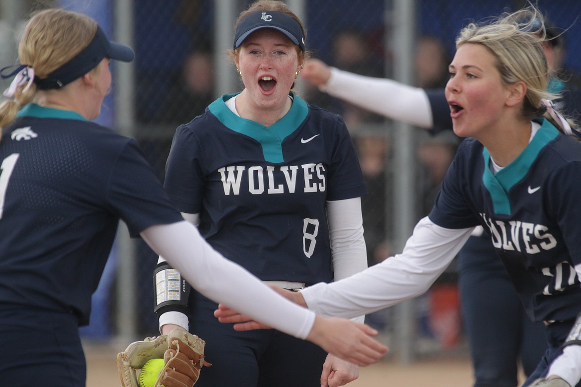 MARK NELKE/Press
Lake City pitcher Kylee Palmer, center, and shortstop Layla Gugino, right, celebrate a double play turned by first baseman Madeline Peterson, left, in the first game Tuesday at Coeur d'Alene.