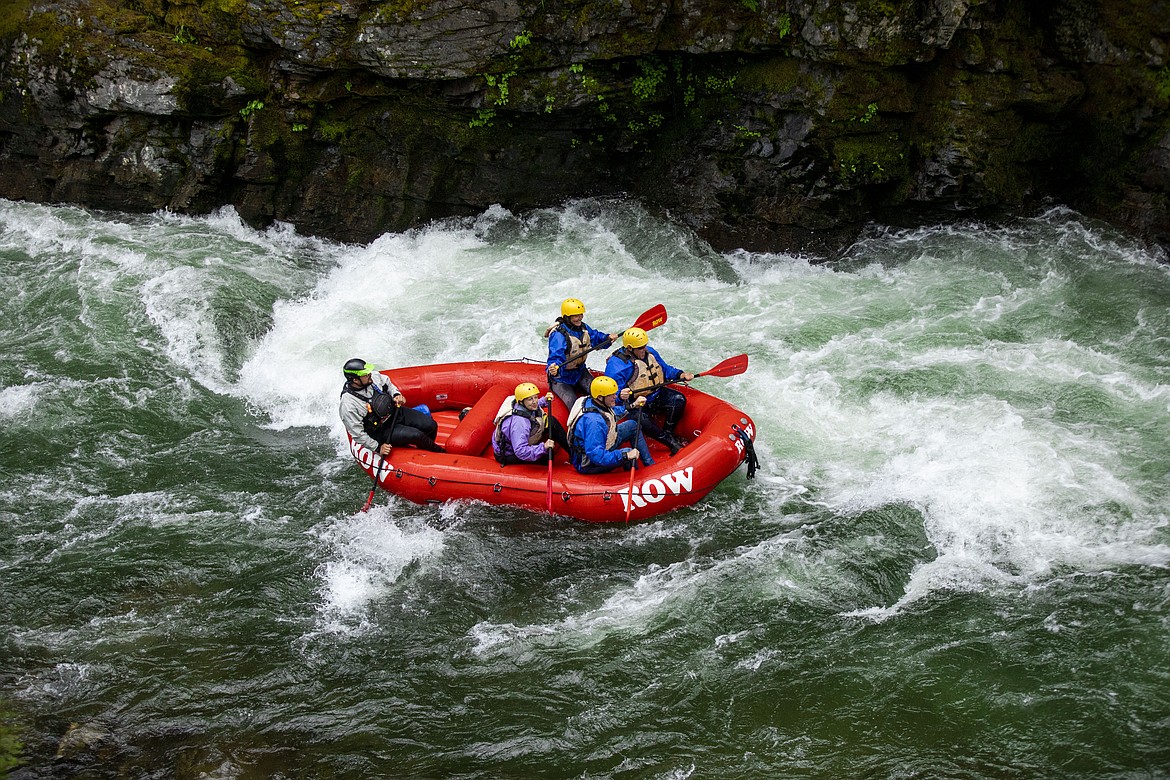 Thrill-seekers on a ROW Adventures rafting trip move long the Saint Joe River.