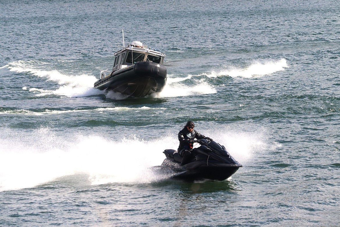 A KCSO marine unit chases a personal watercraft on Lake Coeur d'Alene in a practice run for the public at Higgens Point on Tuesday.