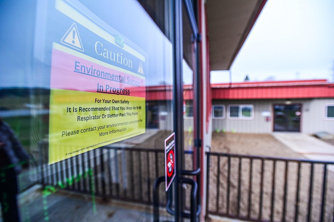 A sign in the door of the "300 building" at Smith Valley School on Wednesday, April 17. The building was closed in the spring of 2023 after mold and asbestos were discovered, which have since been mitigated and abated. (Casey Kreider/Daily Inter Lake)