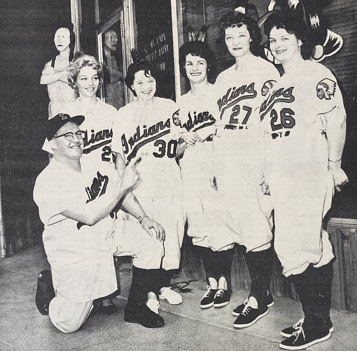 Manager John Freligh of the old Brunswick Café coaches waitresses dressed in Spokane Indians uniforms to promote the Spokane team. Waitresses are, from left, Bonnie Currier, Frances Crider, Babe Williams, queen candidate Pat Stephenson and Sharon Eilers.