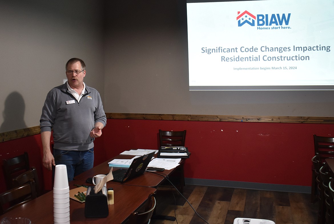 Jim Breidenbach, an educator with the Building Industry Association of Washington, goes over updates to Washington state’s building regulations at a gathering at Chico’s Pizza Parlor in Moses Lake April 10.