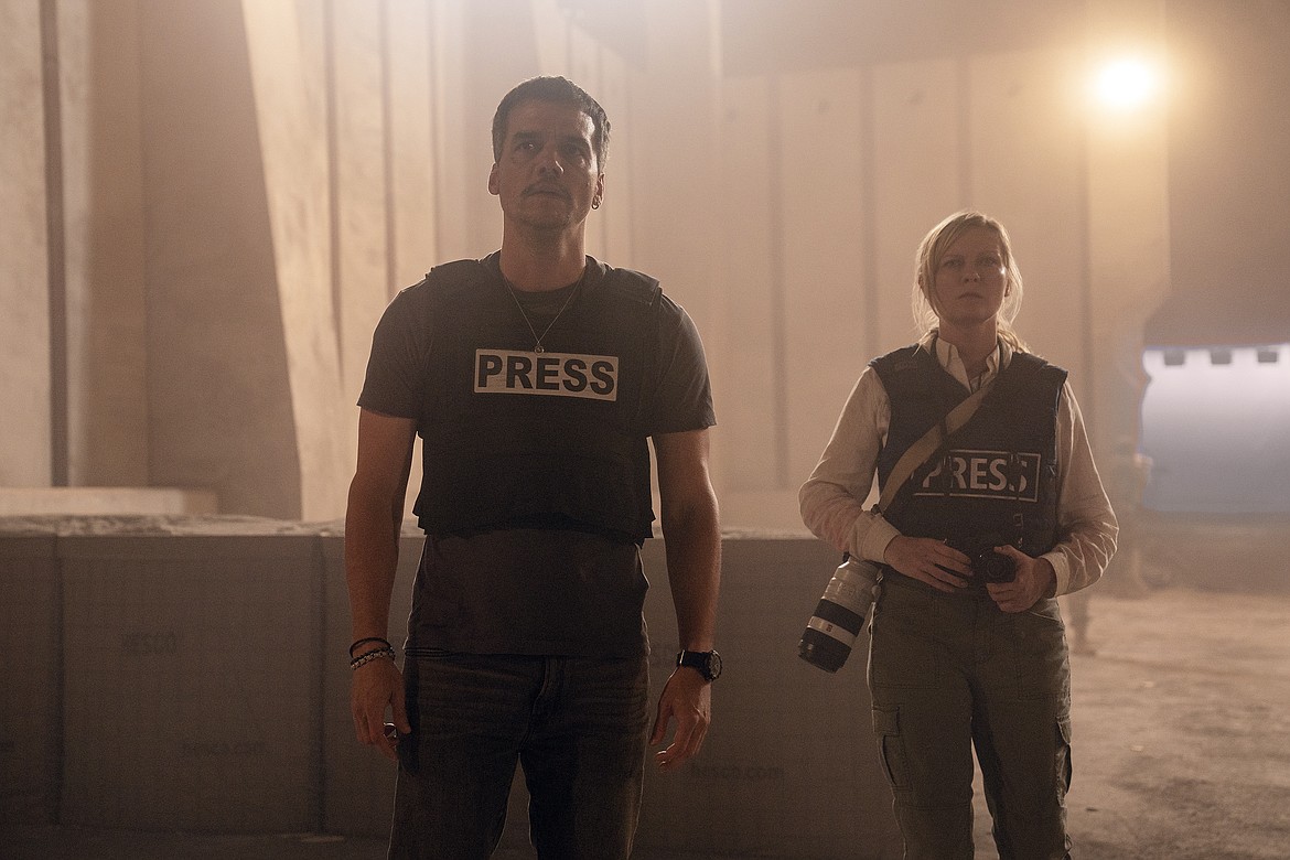 This image released by A24 shows Wagner Moura and Kirsten Dunst in a scene from "Civil War."