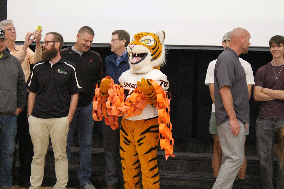 Tao, Ephrata School District’s mascot, happily carried the chain after the ribbon cutting (or chain cutting) at Ephrata Middle School.