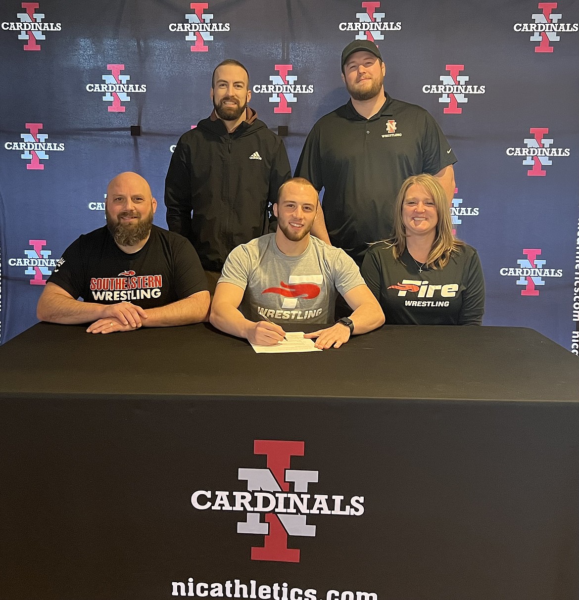 Courtesy photo
Lane Reardon, a sophomore and graduate of Post Falls High who wrestled at North Idaho College the previous two seasons, signed a letter of intent to wrestle at NAIA Southeastern University in Lakeland, Fla. In the back row are NIC wrestling coach Derrick Booth and NIC wrestling assistant coach Cooper Thomas. In the front row are Pete Reardon (dad), Lane Reardon and Tarra Reardon (mom).